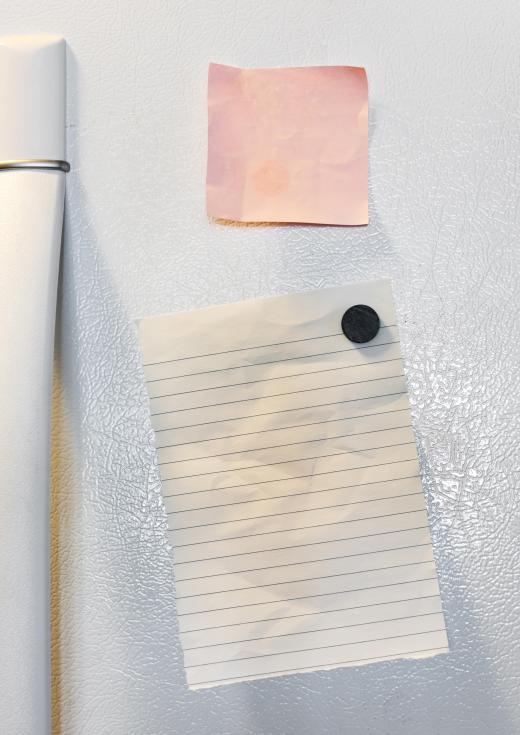 Refrigerator magnets may be used to hold papers against a kitchen appliance.