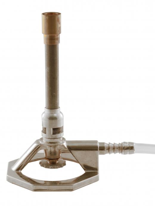 A Bunsen burner, a type of geotechnical laboratory equipment.