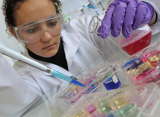 A scientist performing a controlled experiment.