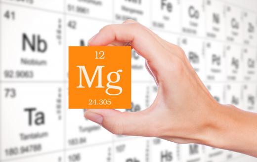 The chemical properties of magnesium include having a tendency to react with halogens, such as chlorine, to form ionic salts.