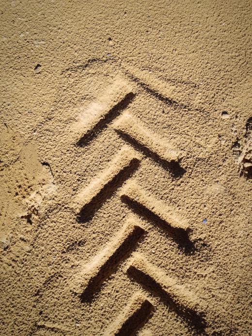 Tire tracks, found at a crime scene, are analyzed in forensics.